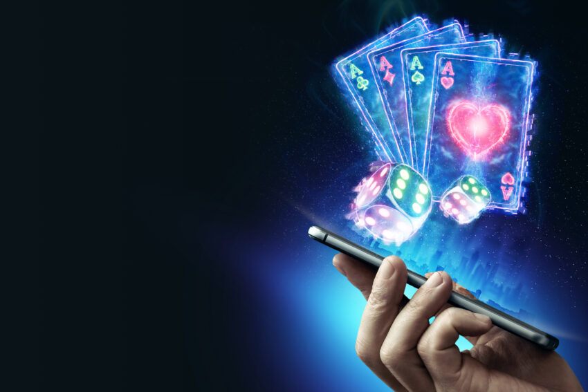 Creative,Background,,Online,Casino,,In,The,Male,Hand,A,Smartphone