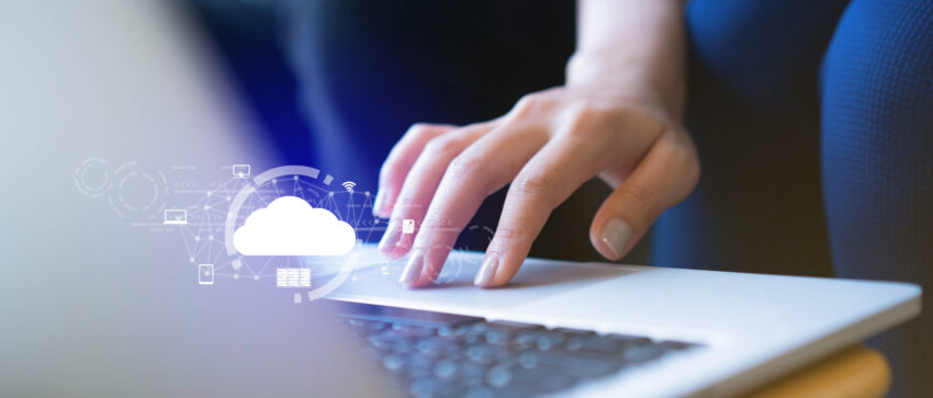 Close,Up,On,Businesswoman,Hand,Working,On,Laptop,To,Synchronize