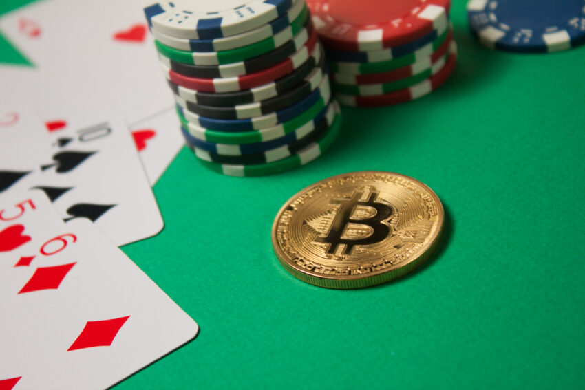 Classic,Playing,Cards,,Chips,,Bitcoin,And,Dollars,On,Green,Background.
