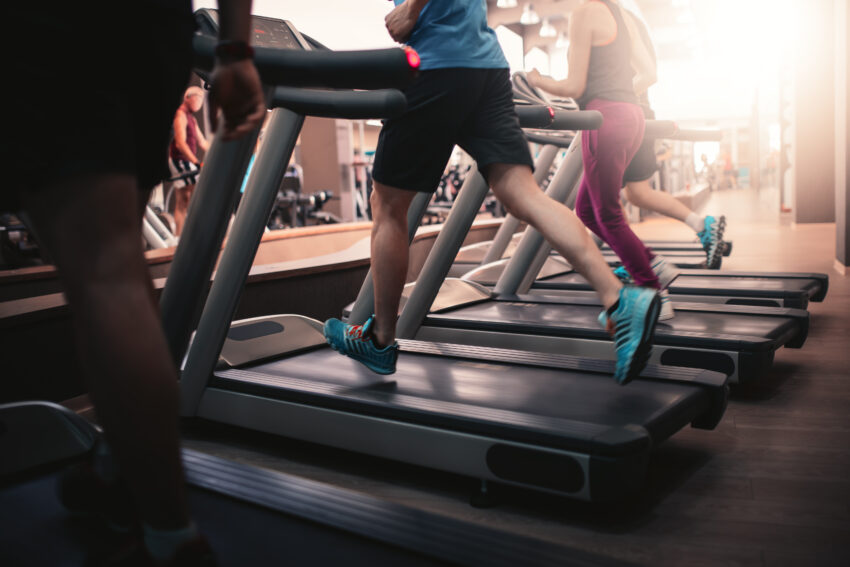 People,Running,In,Machine,Treadmill,At,Fitness,Gym,Club