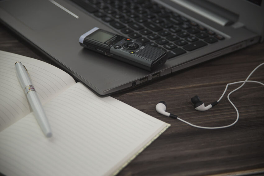 Journalist’s,Work,At,A,Computer,With,A,Voice,Recorder