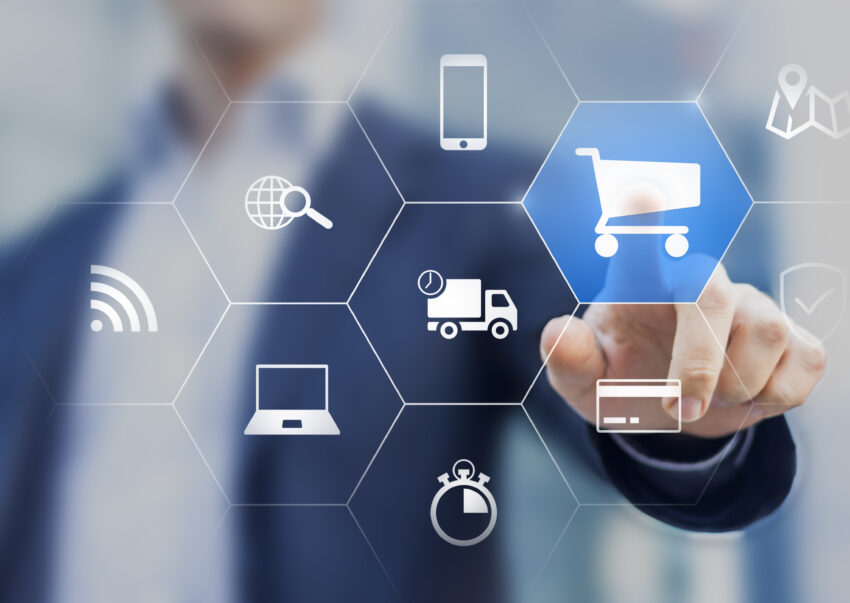 Businessman,Touching,E-commerce,Button,On,A,Virtual,Interface,With,Icons