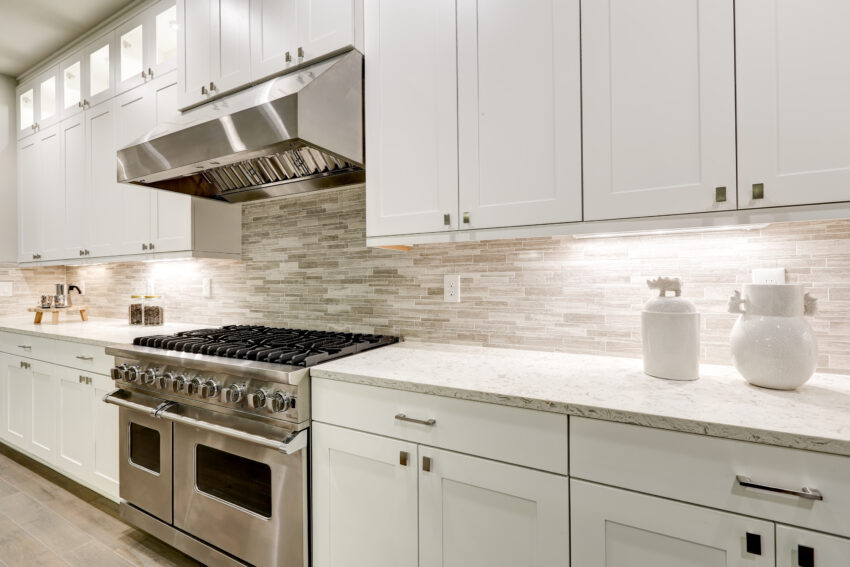 Gourmet,Kitchen,Features,White,Shaker,Cabinets,With,Marble,Countertops,Paired