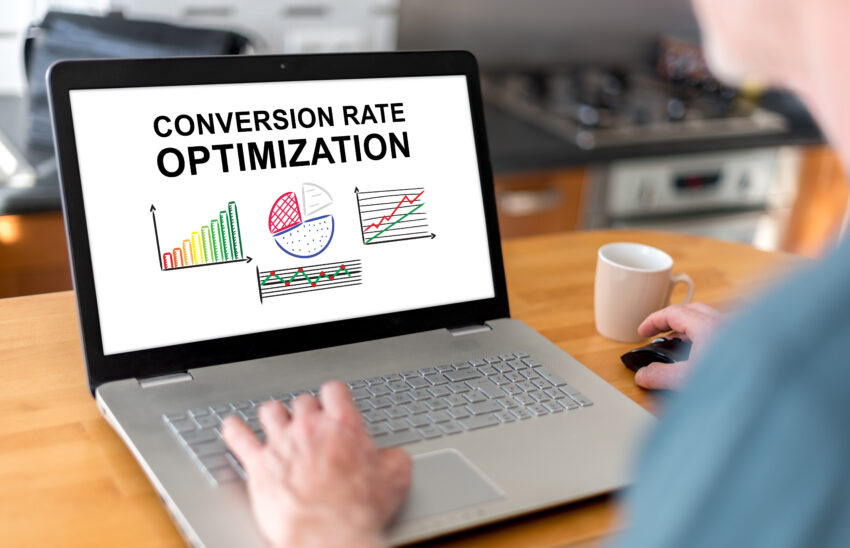 Man,Using,A,Laptop,With,Conversion,Rate,Optimization,Concept,On