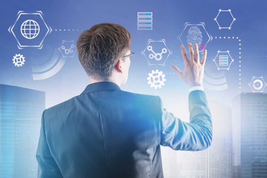 Rear,View,Of,Caucasian,Businessman,In,Glasses,Working,With,Business