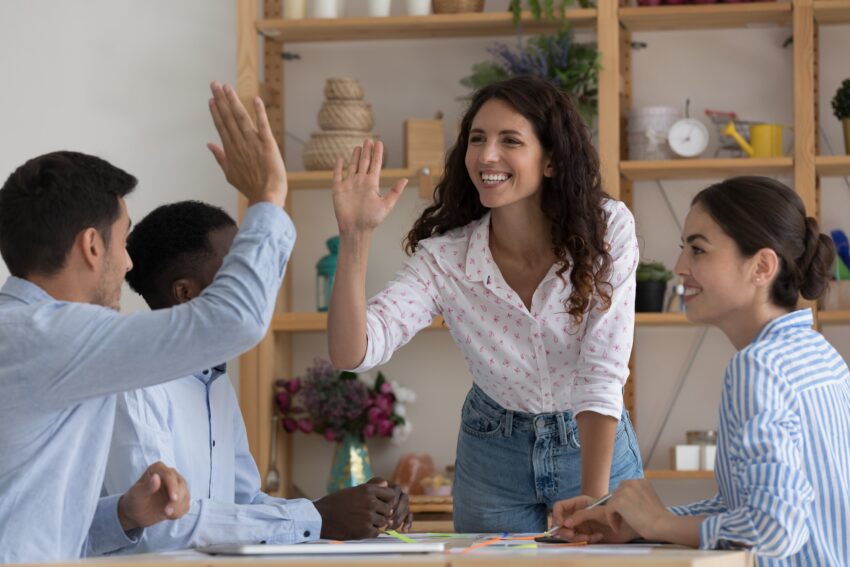 Happy,Excited,Two,Employees,Giving,High,Five,,Celebrating,Team,Success,
