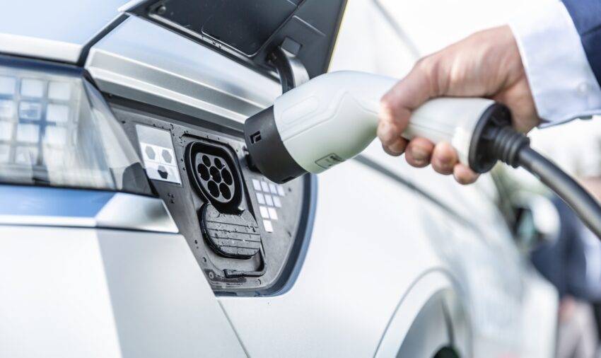 The number of new cars registered in the UK has jumped by nearly 18% but electric vehicle demand is flatlining, prompting the industry to call for a VAT cut to stimulate sales.